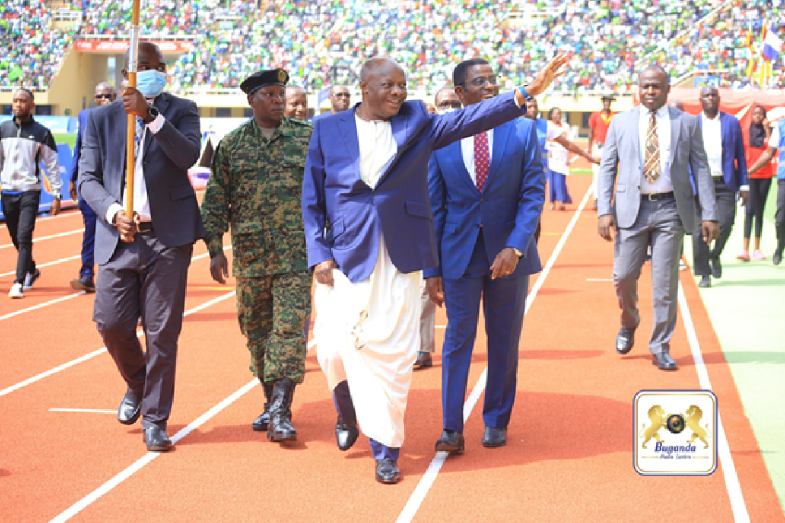 The Kabaka waves to his subjects, sharing a moment of unity and pride at the Masaza Cup final Image